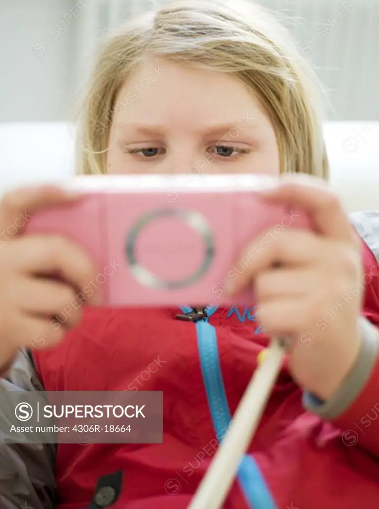 A boy playing PSP, Sweden.