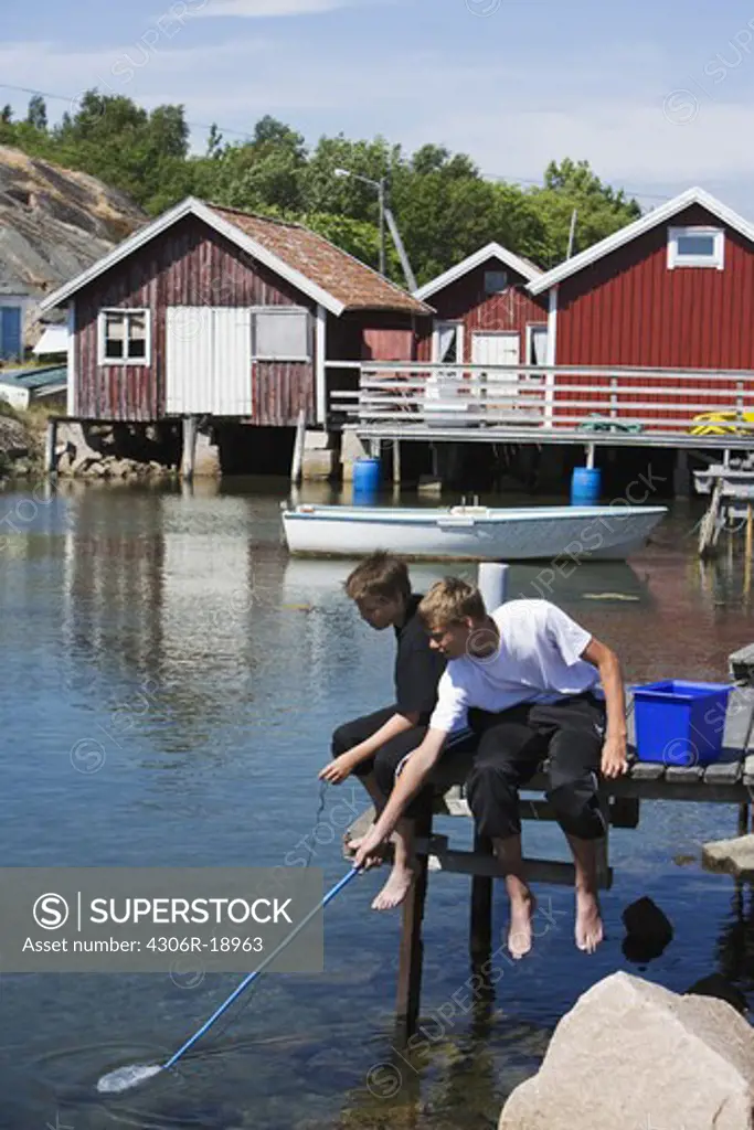 Two boys fishing, Smogen, Bohuslan, Sweden.