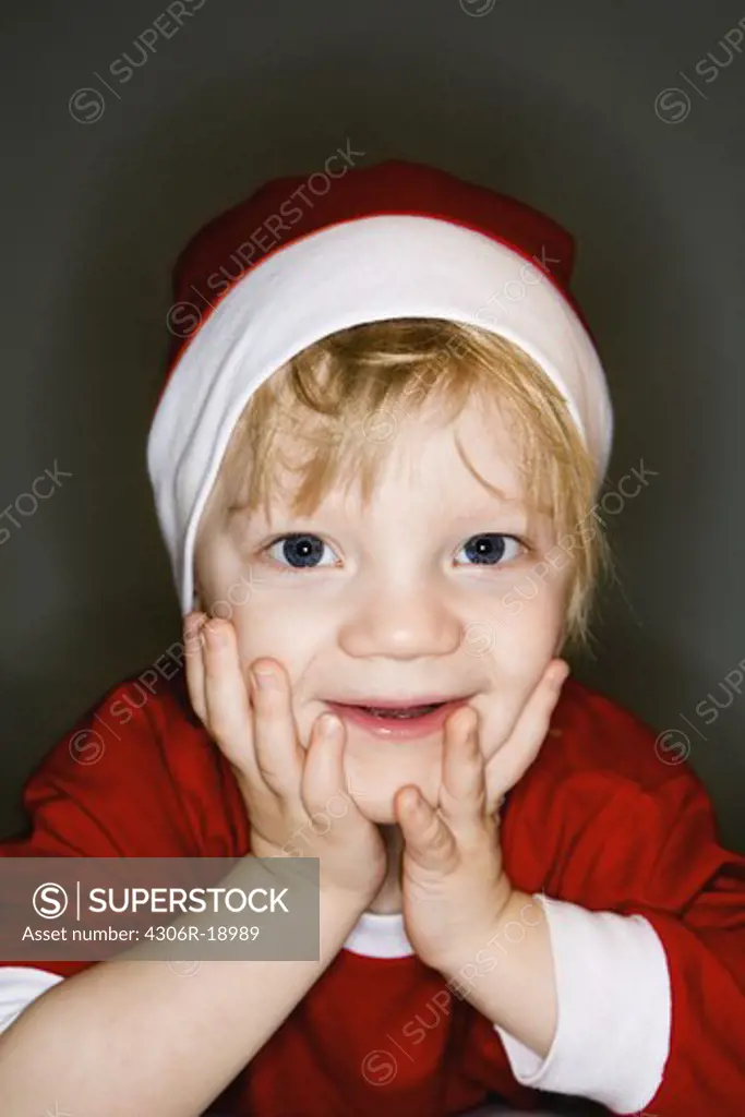 A boy dressed as a Santa, Sweden.