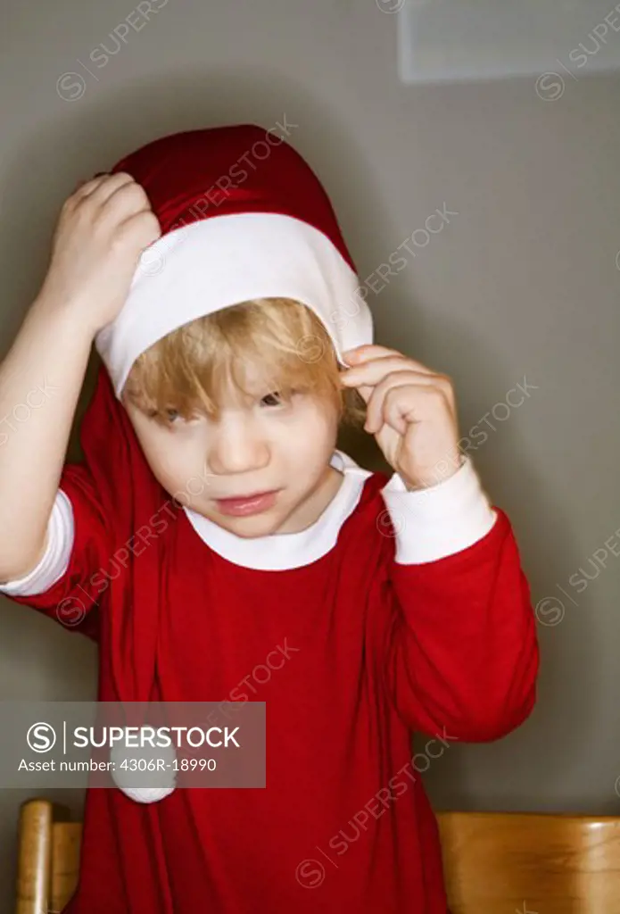 A boy dressed as a Santa, Sweden.
