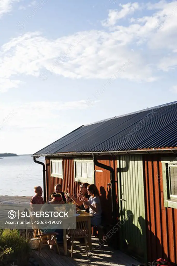 Dinner by a boathouse in the archipelago of Stockholm, Sweden.