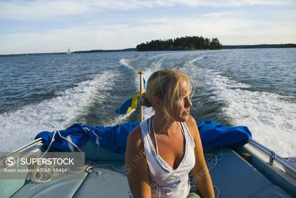 A young woman in a boat, Sweden.