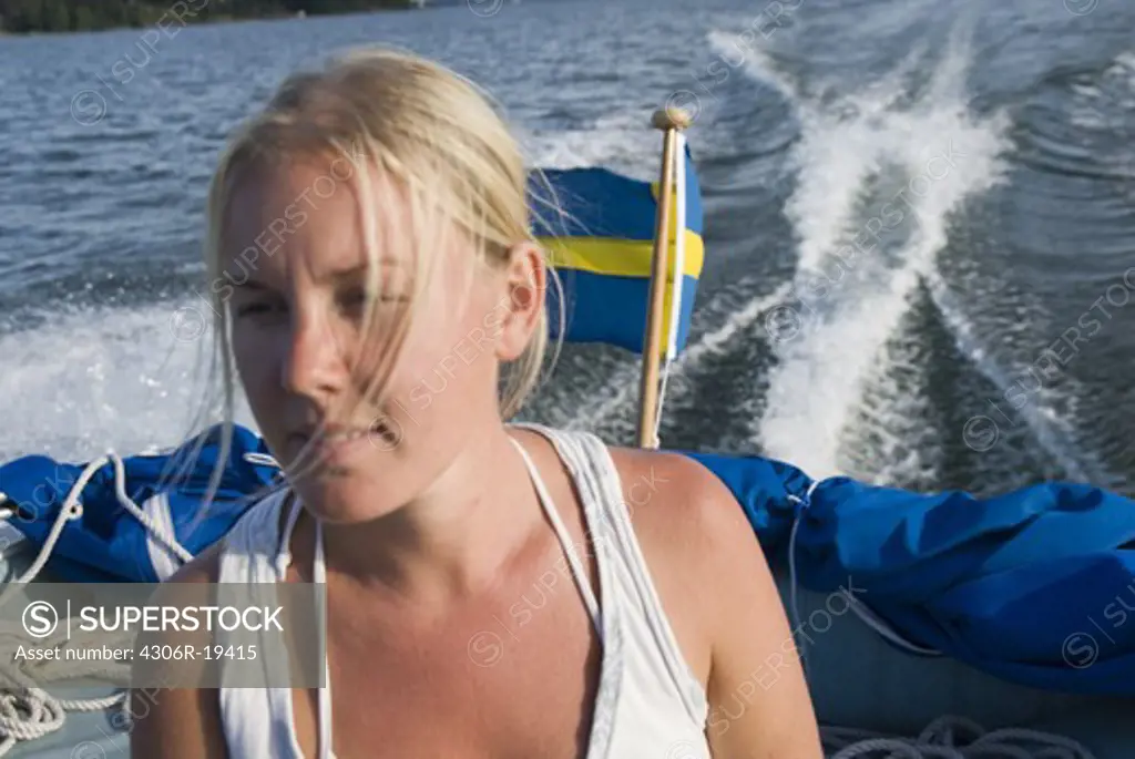 A young woman in a boat, Stockholm, Sweden.