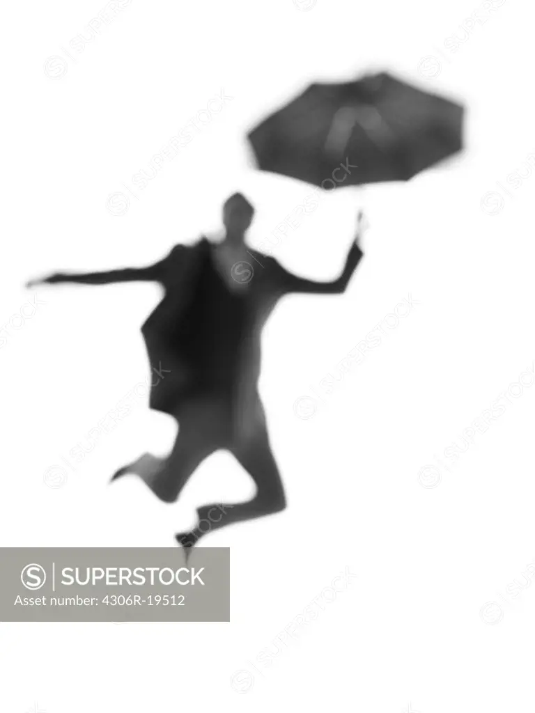 Silhouette of a man with an umbrella.
