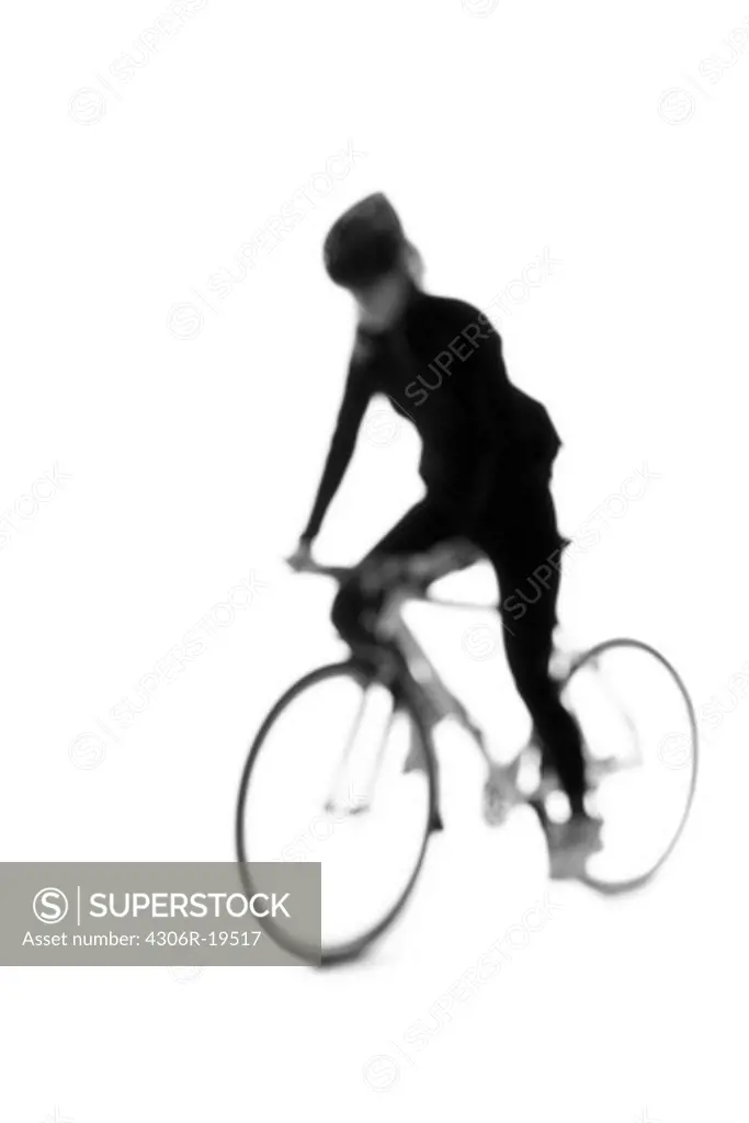 Silhouette of a woman with a bicycle.