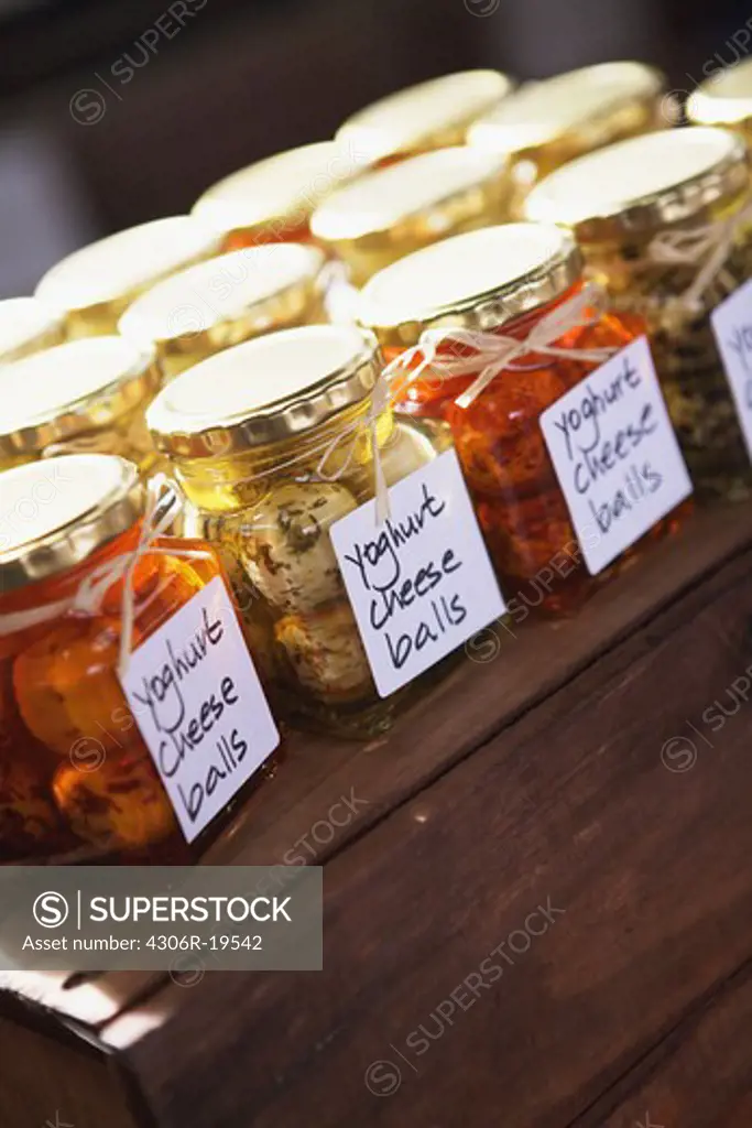 Glass jars with pickled cheese balls, South Africa.