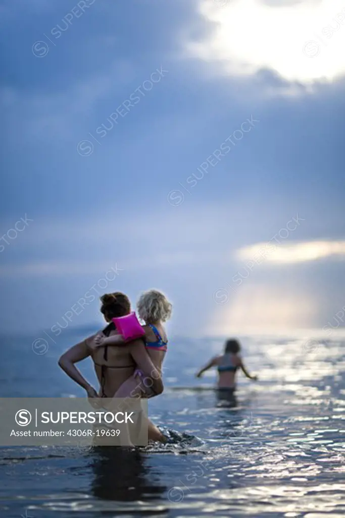 Children bathing in the sea, Sweden.