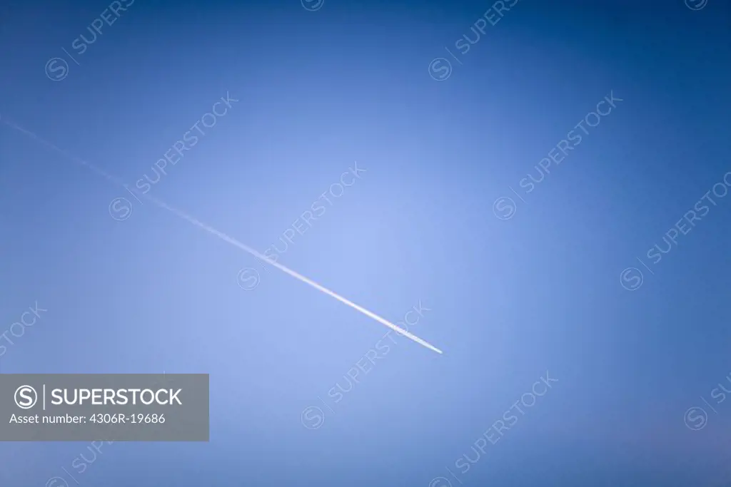 Airplane on a bright blue sky, Sweden.