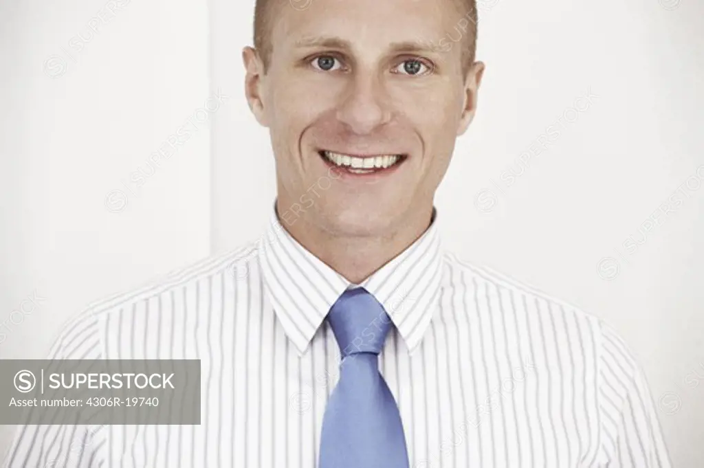 Portrait of a man wearing a tie.