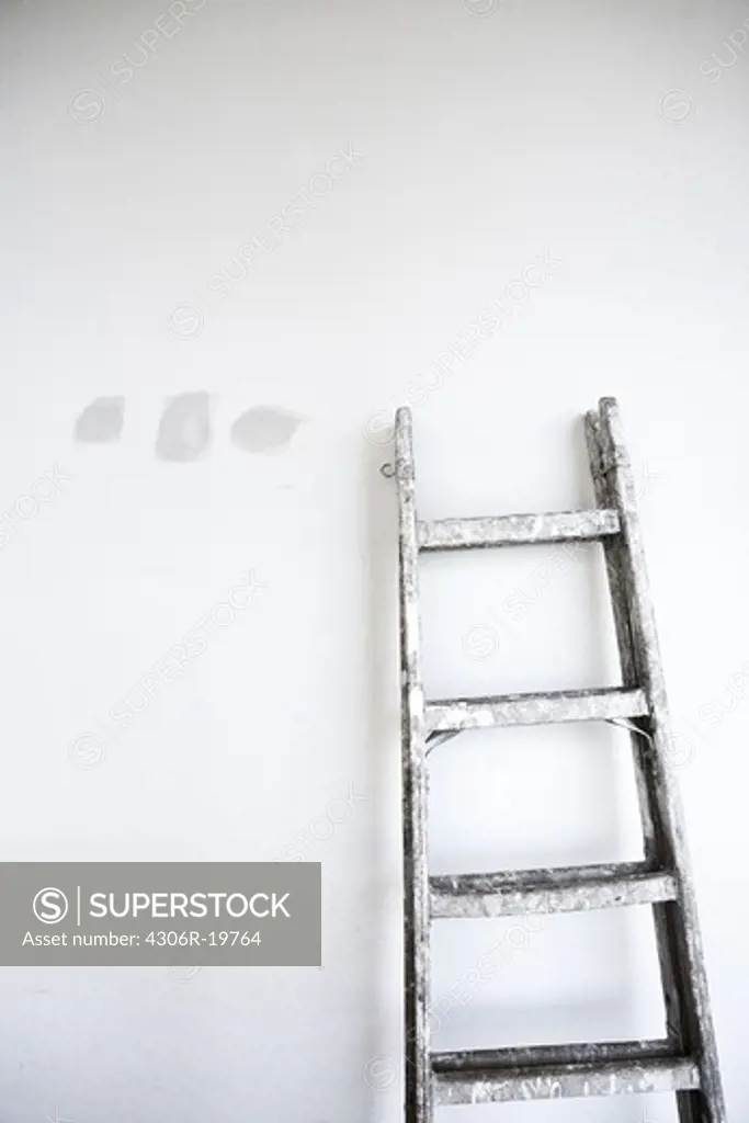 A ladder and putty on a wall, Sweden.