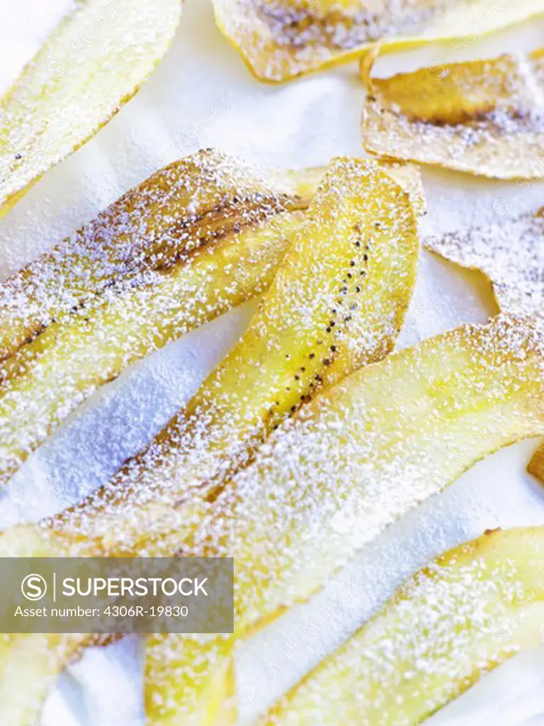 Dried banana dusted with icing sugar, Sweden.