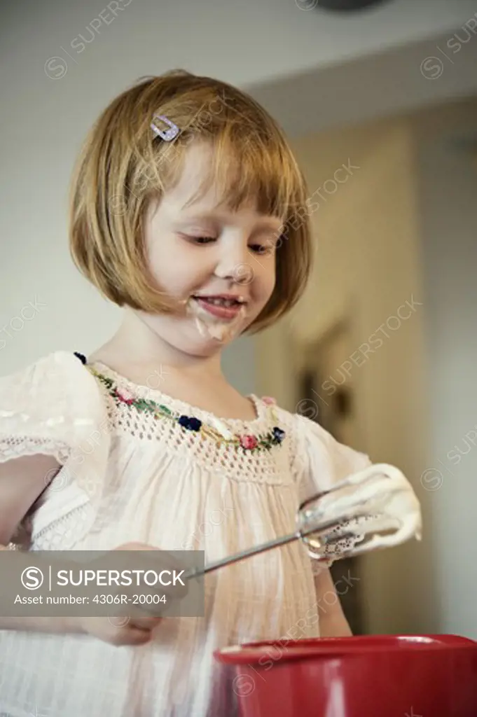 A girl whipping cream, Sweden.