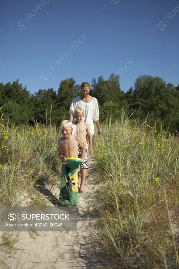 A family walking to the beach, Gotland, Sweden.