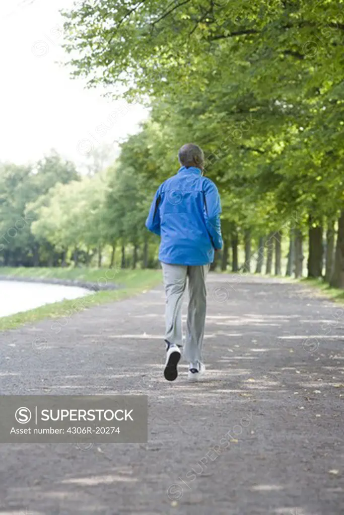 Senior man jogging, Sweden.