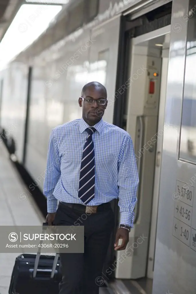 A businessman with a bag at a train station, Stockholm, Sweden.