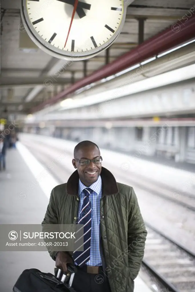 Businessman at a trainstation, Stockholm, Sweden.