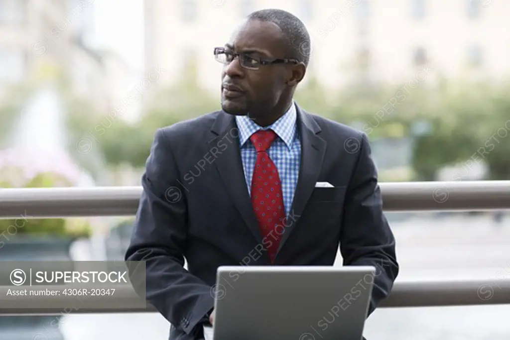 A businessman using a laptop, Stockholm, Sweden.