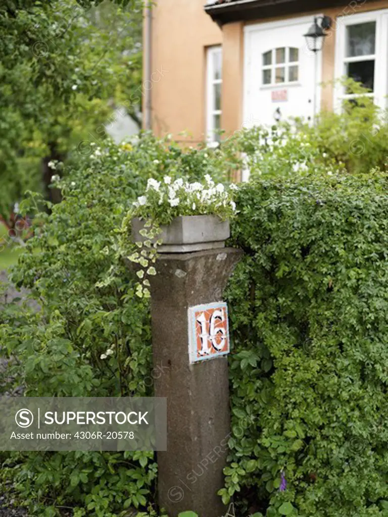 Gatepost in front of a house, Sweden.