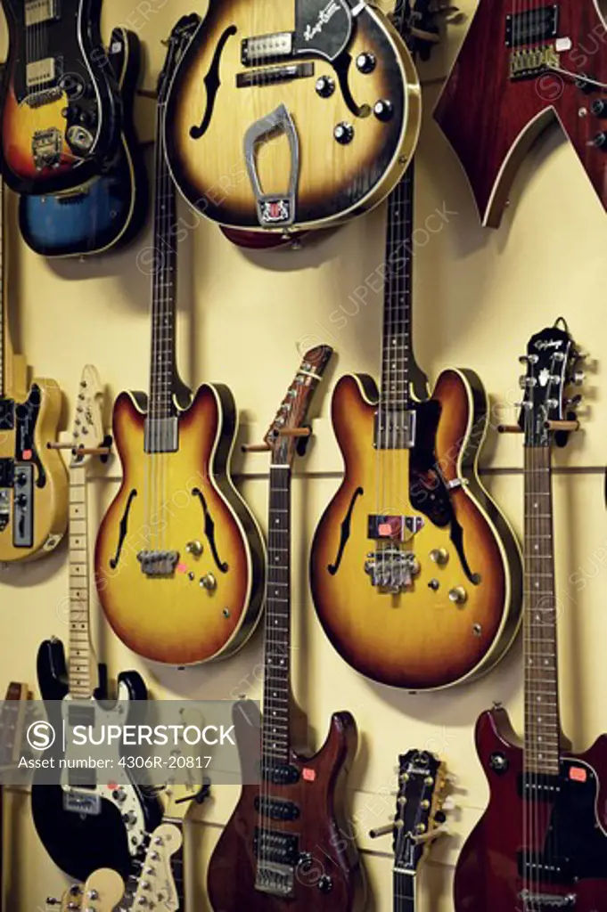 Electric guitars hanging in a shop, Sweden.