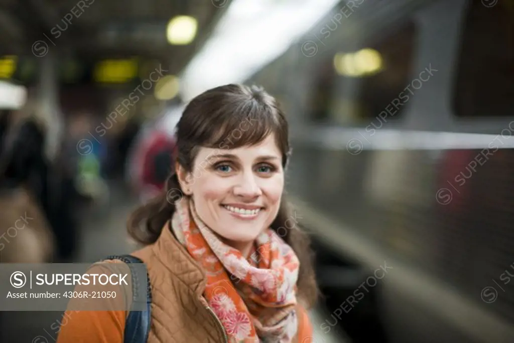 A woman at a railway station, Sweden.