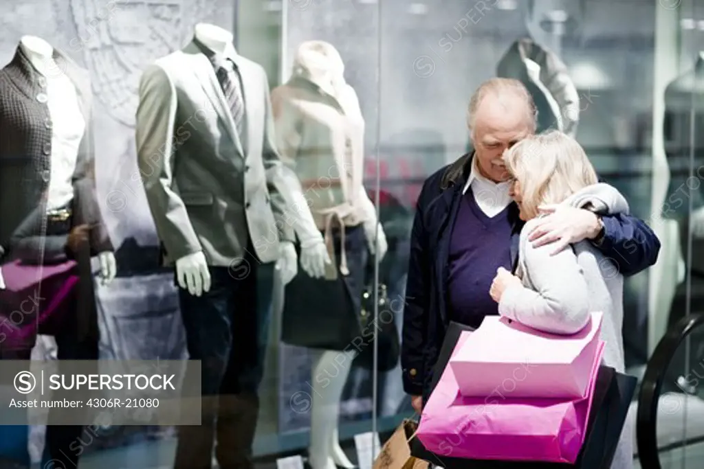 A senior couple window-shopping, Stockholm, Sweden.