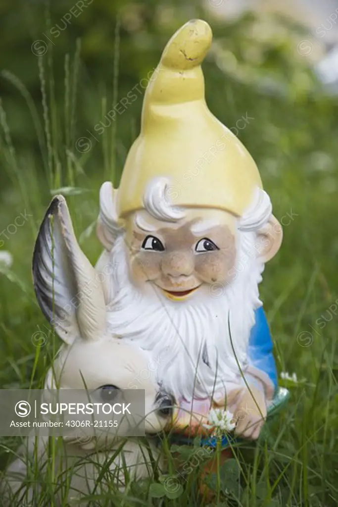 A garden gnome in the grass, Switzerland.