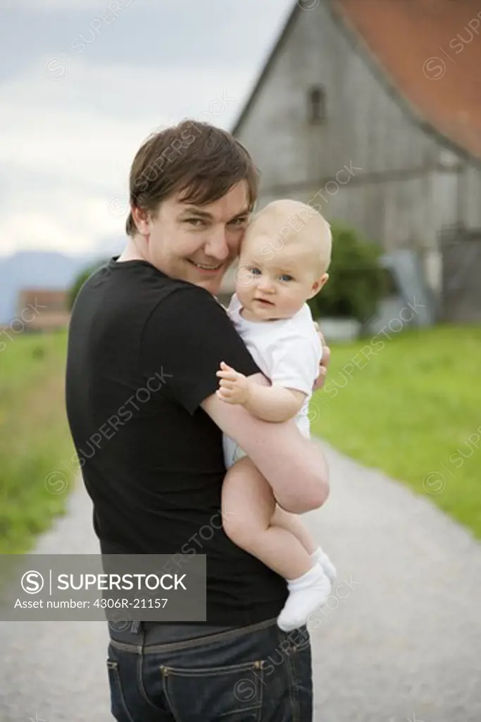 A father holding his baby, Switzerland.