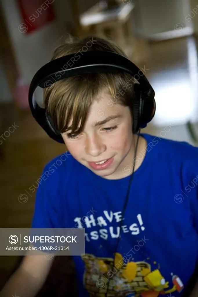 A teenage boy wearing earphones, Sweden.