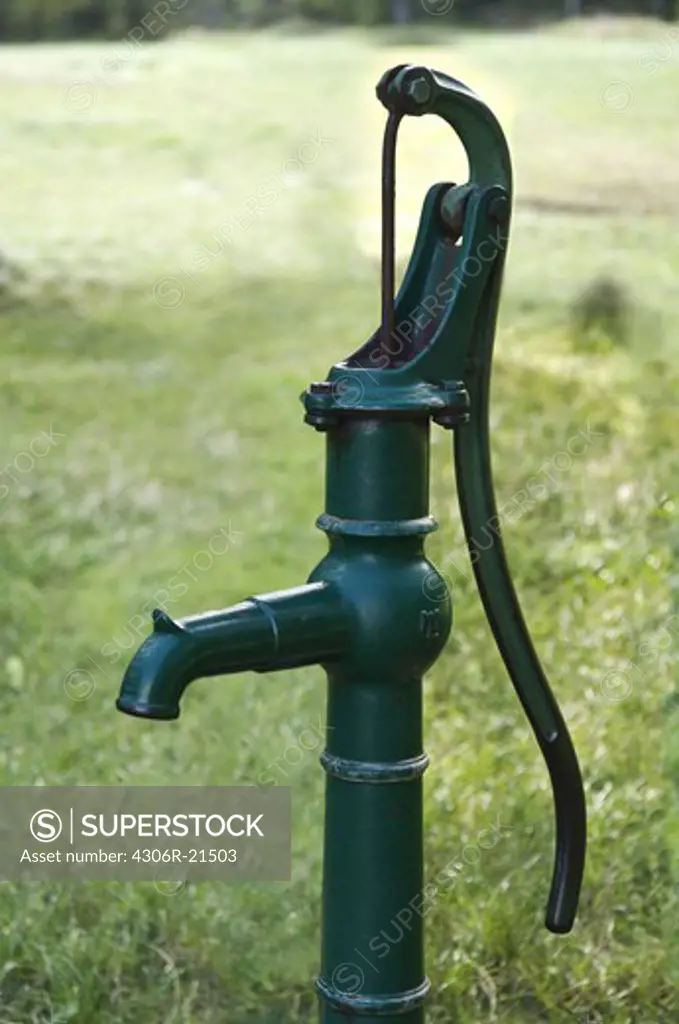 A green water pump, Sweden.