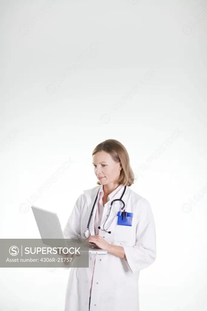 A doctor using a laptop.