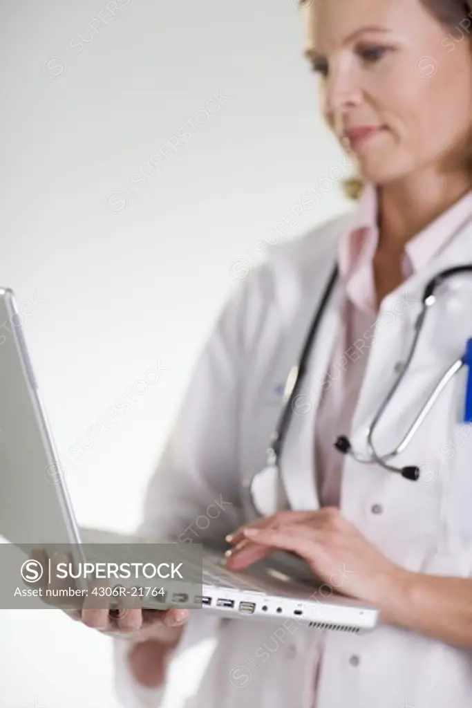 A doctor using a laptop.