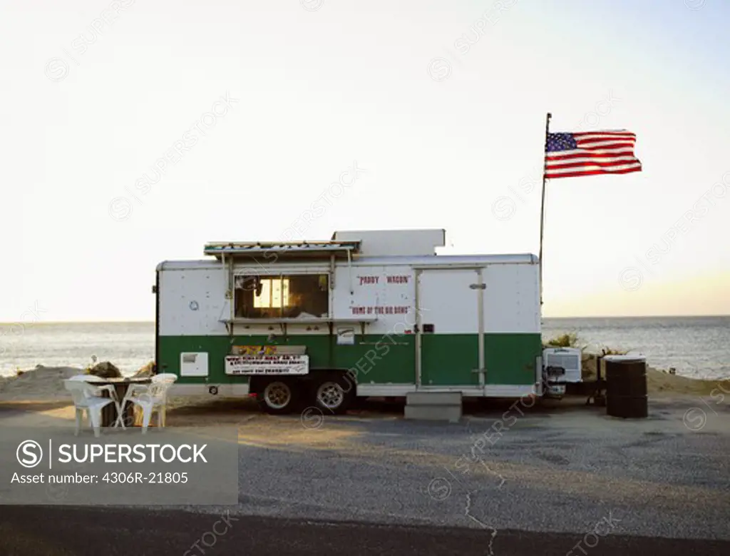 A kiosk by the sea at sunset, USA.