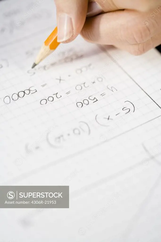 A woman calculating, close-up.