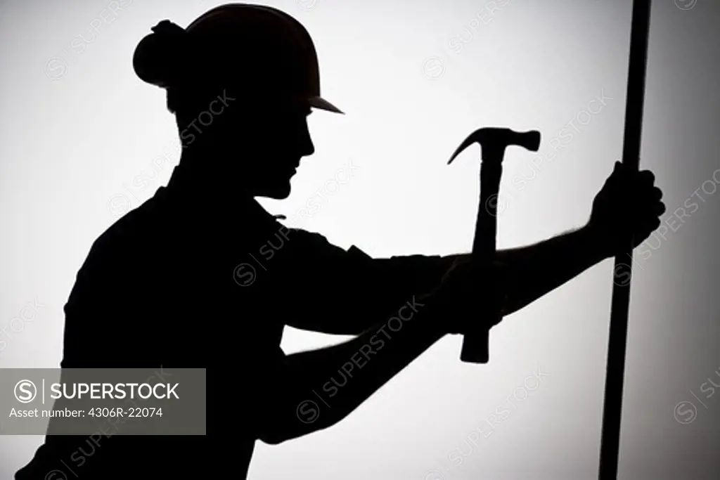 A construction worker using a hammer.