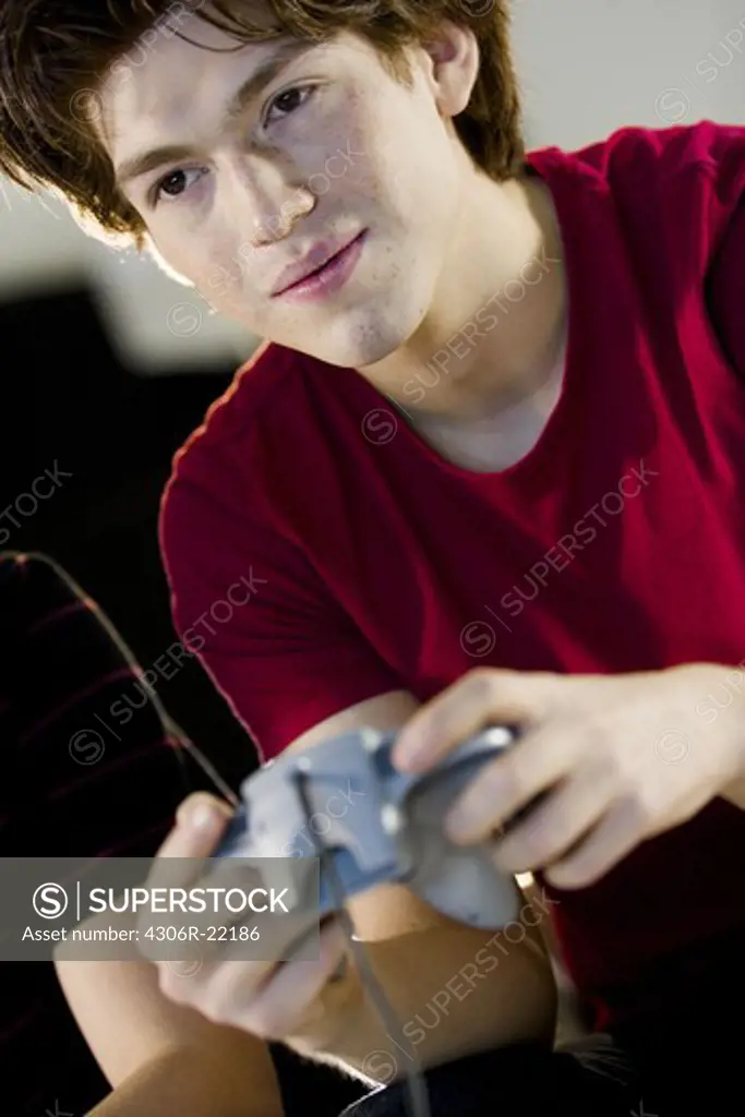 A teenager playing a video game.