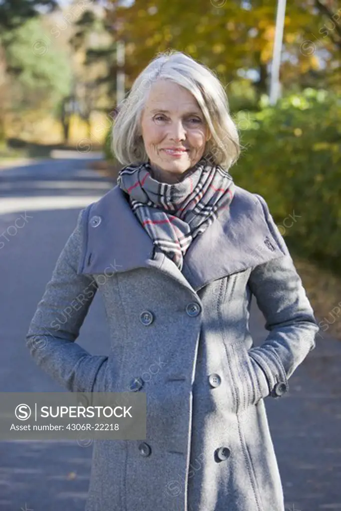 Portrait of a senior woman taking a walk, Sweden.
