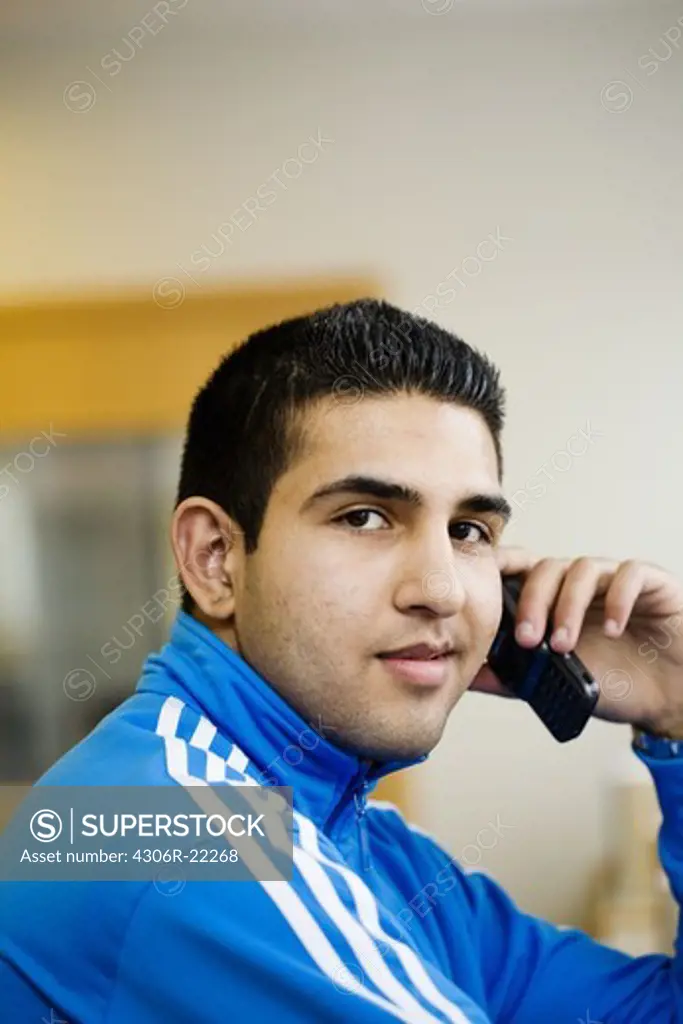 Teenage boy using a mobile phone, Sweden.