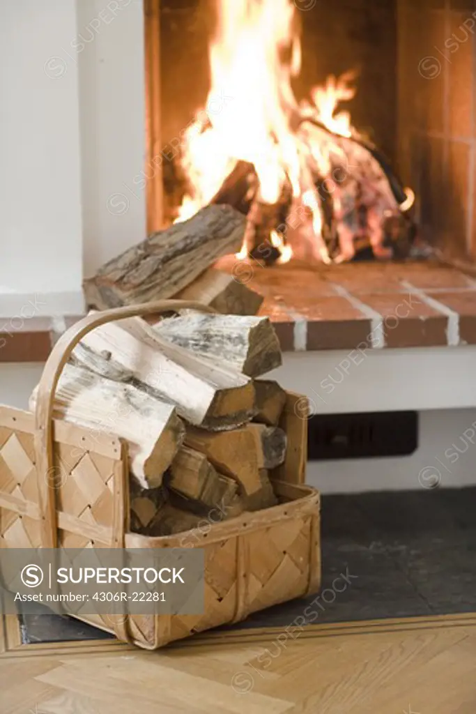 Firewood in front of a fire, Sweden.