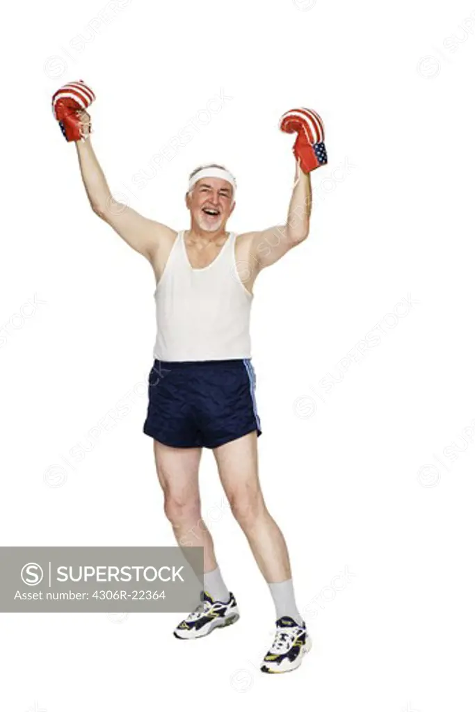 Senior man with boxing gloves.