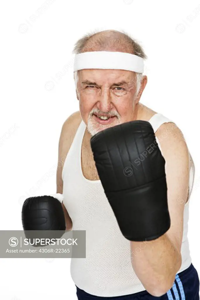 Senior man with boxing gloves.