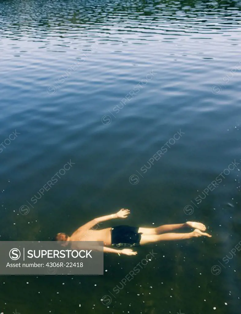 A boy swimming, Sweden.