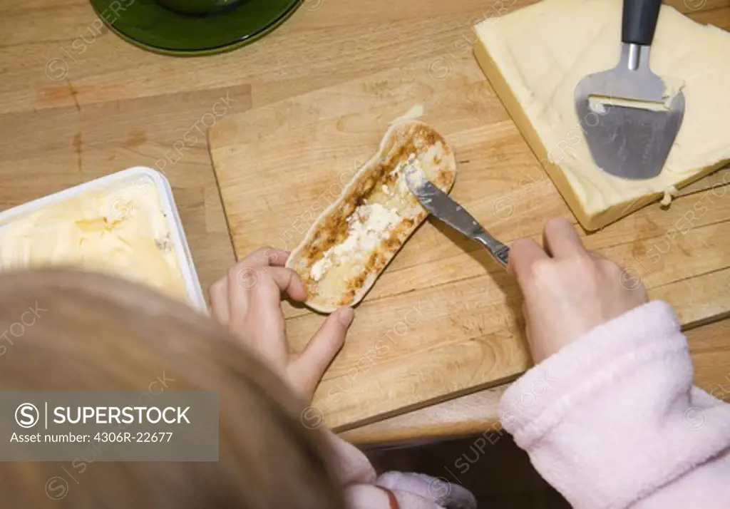 Child making a sandwich, Sweden.