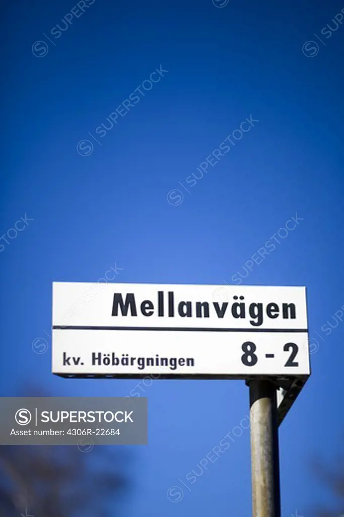 Street sign against a blue sky, Sweden.