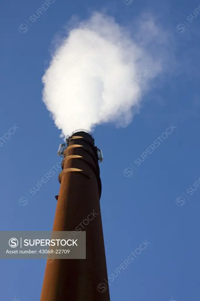 Smoke from a chimney against the sky, Sweden.