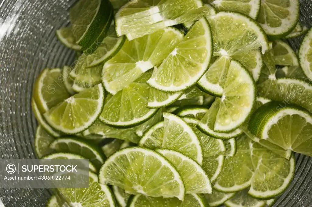 Slices of lime in a bowl, Denmark.