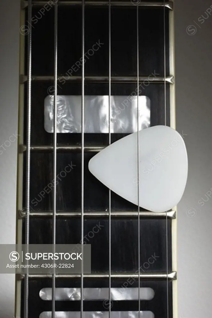 Plectrum on an electric guitar.