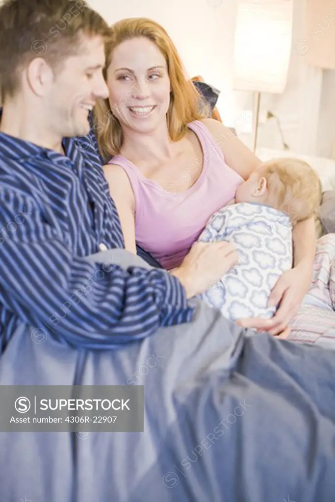 A family in a bed, Sweden.