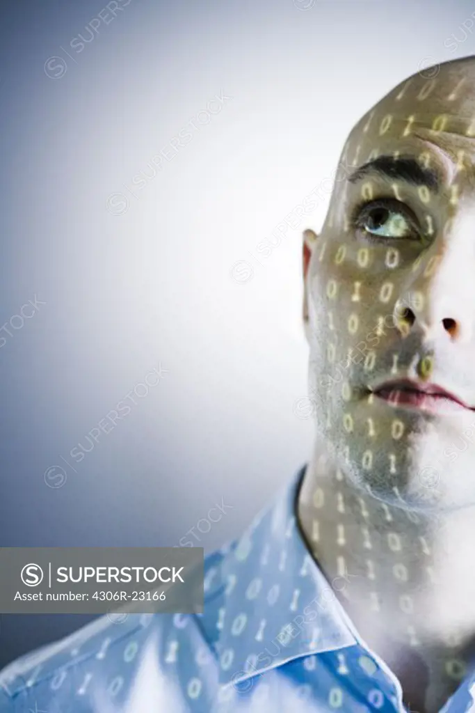 Close-up of a man with digital numbers reflected on his face.