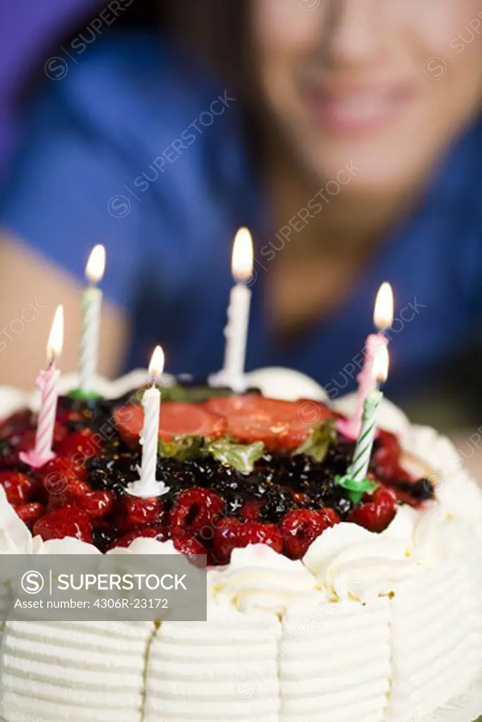 Woman with a birthday cake.