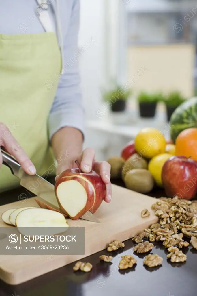 Woman making a fruit salad, Sweden.